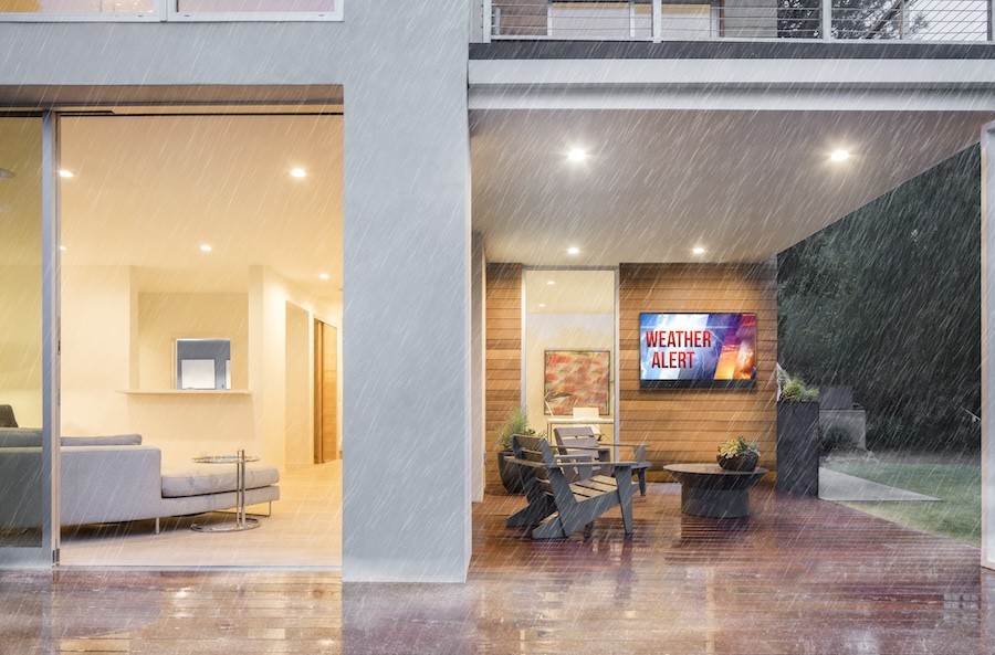 A patio being showered with rain.